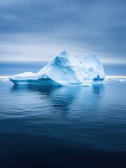 Fototapete - Melting iceberg drifts serenely in dark blue waters under an expansive empty sky. Generative AI