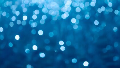 Wall Mural - abstract underwater bokeh lights blurred background with blue, aqua and turquoise sparkling glowing 