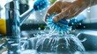 © Usama - A person using an ergonomic, eco-friendly cleaning brush to scrub a sink, with vibrant water splashes.
