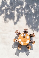 Aufkleber - Minimalist Outdoor Meeting Setup Eco-Friendly Wooden Table with Paper Documents for Collaborative Business Strategy Sessions - Modern Workspace for Young Professionals