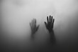© puritut - A black and white photograph of two hands behind a foggy glass creates an eerie atmosphere.