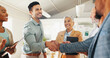 © peopleimages.com - Welcome, handshake or business people with applause in office celebration for interview, onboarding or recruitment success. Thank you, praise and team clapping for man shaking hands for hr contract