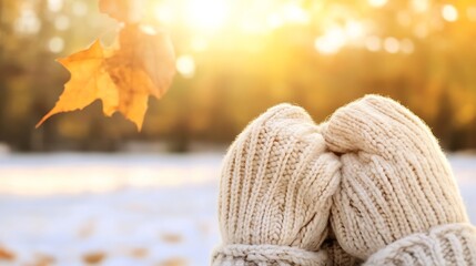 Poster - Cozy Warm Hands Holding Together with Autumn Leaves Against Golden Light : Generative AI