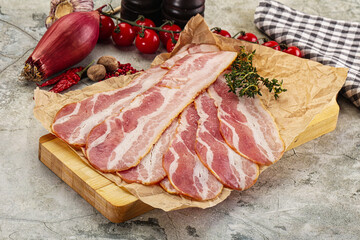 Wall Mural - Sliced pork bacon over board