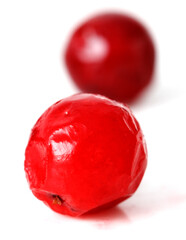 Wall Mural - Two red cherries are sitting on a white background