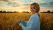© Ari - Blond Agricultural scientist woman holding tablet working in rice field