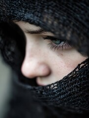 Poster - Close up portrait of a girl with mesmerizing green eyes partially covered by a black shawl in an artistic composition : Generative AI