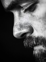 Poster - A closeup shot capturing the intricate details of a bearded man's face in black and white : Generative AI