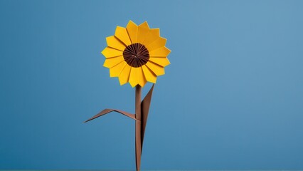 a vibrant origami sunflower stands proudly against a blue background