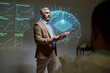 © pressmaster - Portrait of mature male neurologist speaking on future of medicine giving presentation on brain implants during medical conference copy space