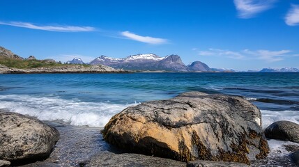 Canvas Print - Scenic coastal landscape with rocky beach and mountains in daylight : Generative AI