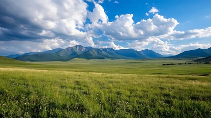 Canvas Print - Vast Green Meadow with Majestic Mountains Under Dramatic Cloudy Sky in Nature : Generative AI