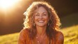 © Mnur - Golden Hour Portrait Of A Smiling Woman With Curly Hair