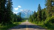 © Pc - A scenic open road leads towards a majestic mountain vista