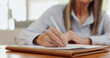 © peopleimages.com - Application, hands writing and retirement home document with tab and checklist for agreement. Paperwork, person and registration for accommodation with information for policy and healthcare survey