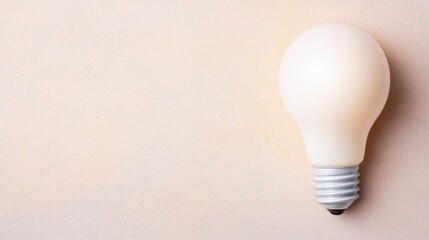 Aufkleber - Illuminating light bulb mounted on a textured wall casting a warm glow in a dimly lit environment