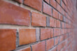 © TEEREXZ - Close-up of a red brick wall background of a cafe