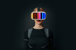 © VISTA by Westend61 - Illustration of a person wearing VR glasses with a colorful interface on a dark background