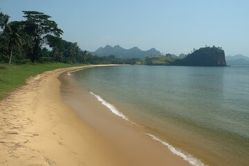 Wall Mural - Serene beach landscape with gentle waves, lush greenery, and distant mountains under clear sky