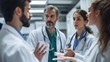 © Aranya - Medical professionals engaged in an intense discussion about emergency