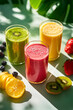 © Denis - Different various and flavors of fruit smoothies with fruits and ingredients around, green background. Healthy lifestyle and nutrition concept.