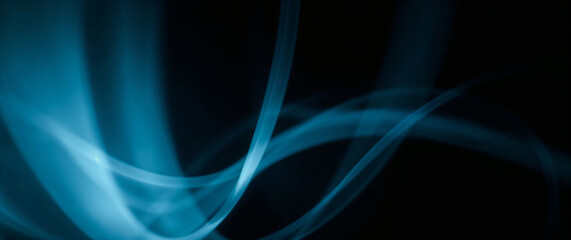 Leinwandbilder - Abstract blue smoke creating wavy pattern on black background