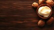 © KYR - A fresh shea nut with creamy butter resting on a textured wooden board, showcasing nature skincare secret