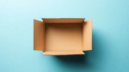 Canvas Print - Open cardboard box on blue background, seen from above, shows empty interior