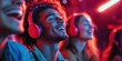 © peerawat - A cheerful scene of a group of friends enjoying music together, sharing headphones connected to a device