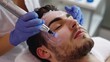 © Emiliia - Cosmetology expert performs rejuvenating facial treatment on male client in modern beauty clinic