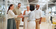 © N Lawrenson/peopleimages.com - Handshake, meeting and business people in office building lobby at corporate, convention, global company for networking. Diversity employees shaking hands for hello, welcome and b2b team introduction