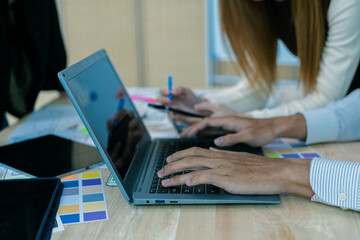 Wall Mural - ux/ui designers discuss and brainstorm layouts for website and mobile app prototypes in website and 