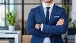 © khonkangrua - Confident Businessman in Formal Suit with Arms Crossed in Modern Office Environment