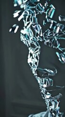 Poster - A captivating display features a metallic sculpture resembling human forms, embodying movement and emotion.