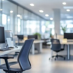 Poster - Modern Office Interior with Computer Workstations and Ergonomic Chairs in a Clean and Bright Environment