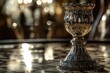 © Ева Поликарпова - A silver cup sits atop a table, perfect for use in corporate or event settings