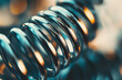 © Nomad_Soul - Closeup of shiny metal spring. Generative AI