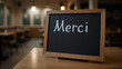 © Irina - Rustic French Merci Chalkboard in Cozy Cafe Interior