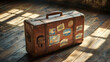 © Leopard - Vintage suitcase adorned with travel stickers resting on an old wooden floor highlighted by soft, warm lighting