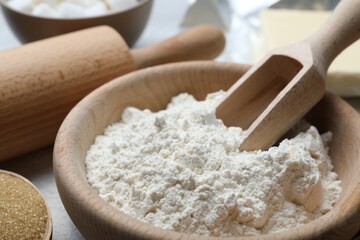 Sticker - Ingredients for dough and rolling pin on table, closeup