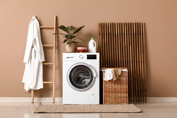 Wall Mural - Modern washing machine, ladder and basket with dirty clothes in laundry room