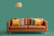 © Pixel-Shot - Cozy sofa with cushions and hanging lamp on green background