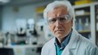 © Daiki - A senior man with white hair wearing a lab coat and protective goggles stands in a laboratory, exuding professionalism and confidence in his scientific pursuits.