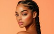© Surachetsh - Young Black woman with impeccable cosmetic artistry and chic, high end fashion sense, set against clean, solid color backdrop. Her style conveys understated elegance and opulence.