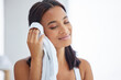 © peopleimages.com - Beauty, towel and wipe with woman in bathroom of home for cleaning, hygiene or morning routine. Fabric, satisfied and smile with happy person washing face for dermatology, skincare or wellness