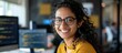 © MINHOO - Young female Indian IT developer programmer working with laptop in the office. AI generated image