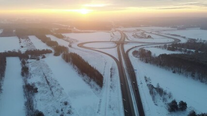 Canvas Print - Winter aerial of sunset and quiet road