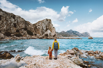 Wall Mural - mother and child traveling in greece walking on the beach rhodes island outdoor family lifestyle tog