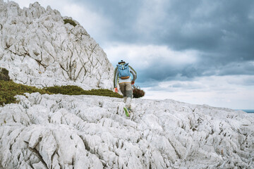 Wall Mural - active man trail running in greece rocky mountains traveling in rhodes island with backpack, outdoor