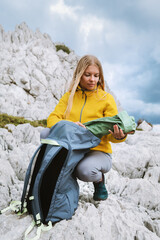 Wall Mural - woman traveling solo with backpack hiking in mountains of greece active adventure lifestyle, female 
